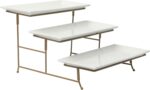 Three-tier serving set with white rectangular plates and a gold metal stand, displaying various snacks.