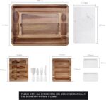 A large hecef acacia wood charcuterie board set with cheese, crackers, and fruit, showing the pull-out drawers and knife set.