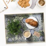 Rectangular seaweed-colored plastic serving tray with integrated handles, displayed on a coffee table.