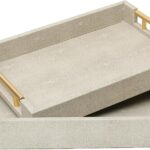 Two rectangular ivory faux shagreen serving trays with brushed gold handles, one larger and one smaller, stacked slightly.