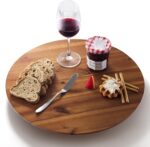 An 18-inch round Tidita acacia wood lazy susan turntable on a kitchen countertop, showcasing its natural wood grain.