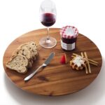 An 18-inch round Tidita acacia wood lazy susan turntable on a kitchen countertop, showcasing its natural wood grain.