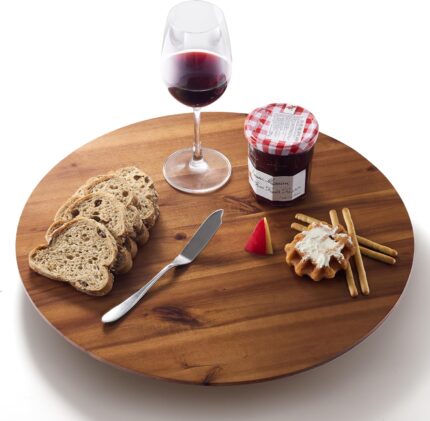 An 18-inch round Tidita acacia wood lazy susan turntable on a kitchen countertop, showcasing its natural wood grain.