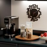 An 18-inch round Tidita acacia wood lazy susan turntable on a kitchen countertop, showcasing its natural wood grain.