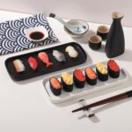 Two black rectangular ceramic trays by VanEnjoy, ideal for organizing soap bottles and toiletries on a bathroom or kitchen co