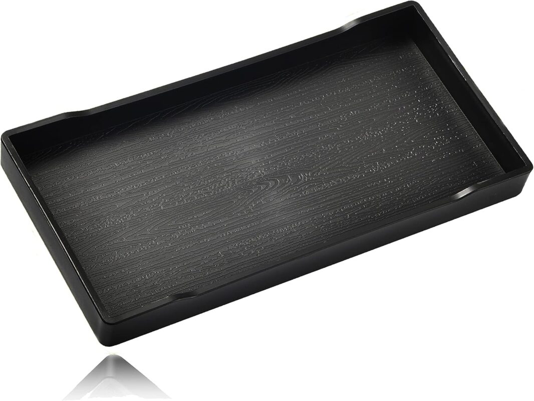 A sleek, small black rectangular plastic tray from VCREATC, ideal for organizing soaps or vanity items on a countertop.