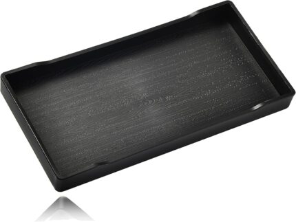A sleek, small black rectangular plastic tray from VCREATC, ideal for organizing soaps or vanity items on a countertop.