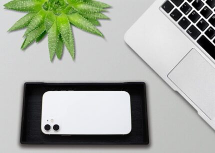 A sleek, small black rectangular plastic tray from VCREATC, ideal for organizing soaps or vanity items on a countertop.